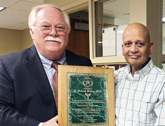 Long-time Putnam County Sheriff Howard Sills (left) pictured with Dr. Rakesh Kumar (right). IAN TOCHER/Staff